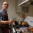 Dr. Jelle Hellings baking oliebollen, a Dutch pastry typically enjoyed during New Years Eve
